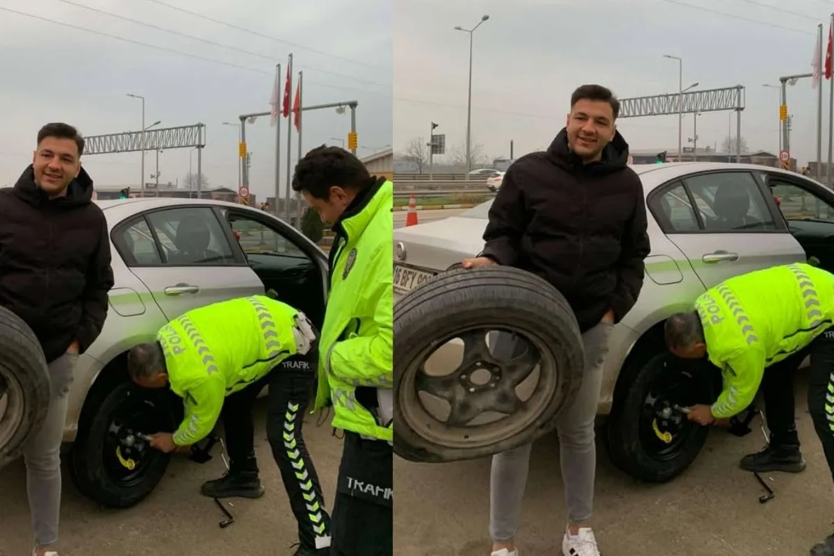 İnegöl'de patlayan lastiği polisler değiştirdi!