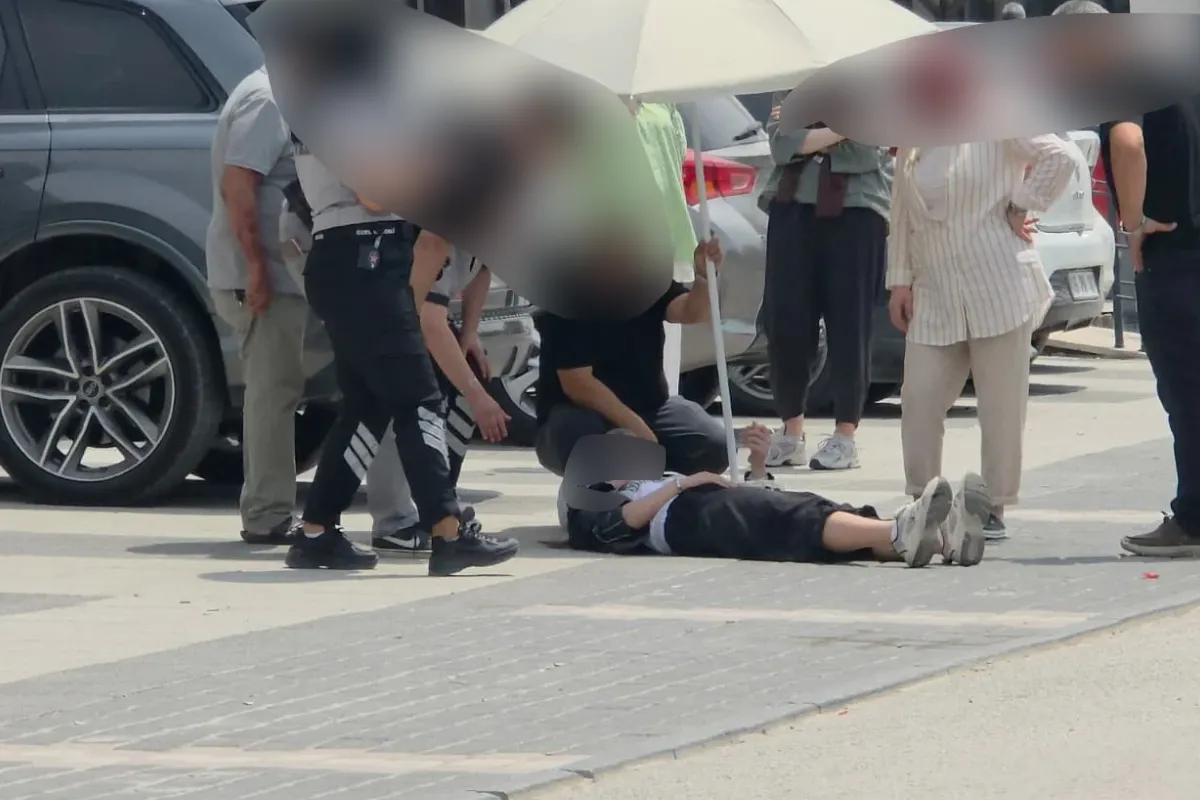 İnegöl'de kaza yapan kadını güneşten korumak için seferber oldular