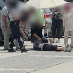 İnegöl'de kaza yapan kadını güneşten korumak için seferber oldular
