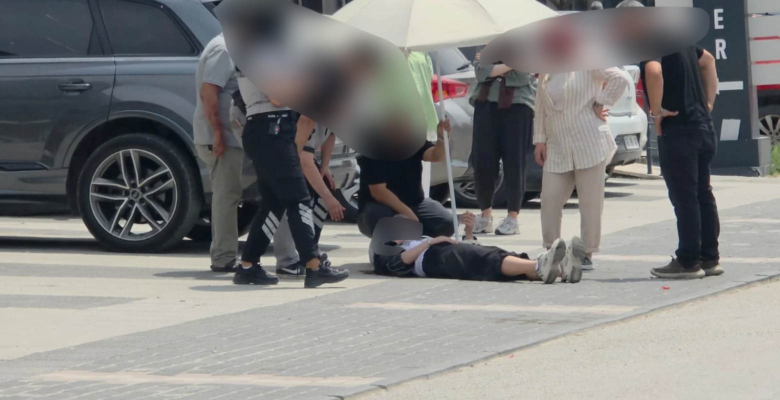 İnegöl'de kaza yapan kadını güneşten korumak için seferber oldular